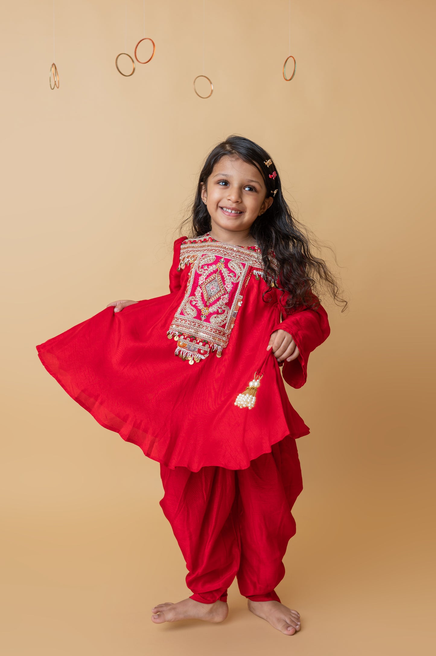 Girls Embroidered Yoke Tassels Enhanced Red Kurti And Dhoti